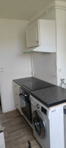 Photo de galerie - Meuble et hotte 
raccordement électrique et plomberie 