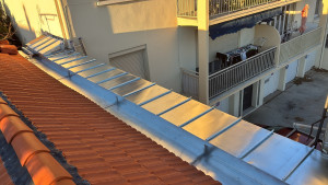 Photo de galerie - Réflection chêneau et dessus en zinc