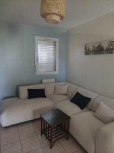 Photo de galerie - Salon beige et gris.
