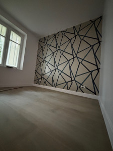 Photo de galerie - Pose un papier peint sur un mur