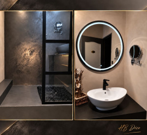 Photo de galerie - Réalisation d'un béton ciré décoratif dans une salle de bains, avec recouvrement des murs en faïence et finition de l'espace douche, pour un rendu moderne et élégant  