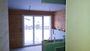 Photo de galerie - Rénovation appartement sur la station du Chazelet. Travaux de plâtrerie plafond, cloison avec isolation thermique et habillage murs en parement bois.