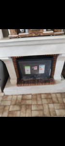 Photo de galerie - Pose d un insert et du tubage dans une cheminée ouverte 