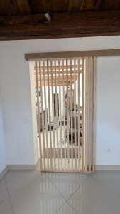 Photo de galerie - Porte coulissante en claustra sur mesure 