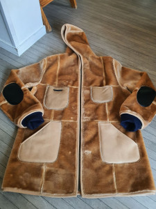 Photo de galerie - Apport de poches, fermeture, coudes et bordcoat. 