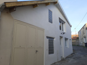 Photo de galerie - Réalisation d'un enduit de finition lisse sur une façade 