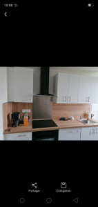 Photo de galerie - Pose d'une cuisine complète avec meuble haut et hotte.