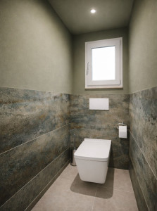Photo de galerie - Réalisation complète – WC 
Pose de carrelage au sol, faïence murale à motif minéral et peinture, avec une harmonie de teintes naturelles pour un rendu moderne et élégant.
Travail réalisé avec soin, de la préparation aux finitions, avec une attention p