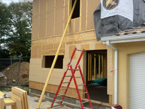 Photo de galerie - Extension en ossature bois avec isolation de panneaux de fibre de bois 