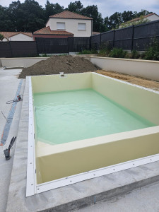 Photo de galerie - Réalisation de manbrane armée couleur sable 