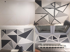 Photo de galerie - Cette réalisation présente une cuisine aménagée en L, optimisant l'espace disponible. Elle est équipée de meubles bas aux façades sombres, complétés par un plan de travail gris anthracite. Un évier encastré est positionné sous une fenêtre offrant une vue 