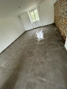 Photo de galerie - Pose de carrelage 60/60 avec des dessins de pierre