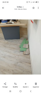 Photo de galerie - Pose de parquet dans un bureau.
