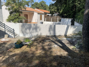 Photo de galerie - Application d’un enduit à la machine finition projeter / moucheter 