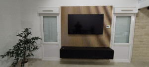 Photo de galerie - Habillage de mur et installation de meuble et TV