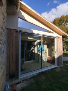 Photo de galerie - Remplacement d'un auvent dégradé par une véranda en bois sur mesure