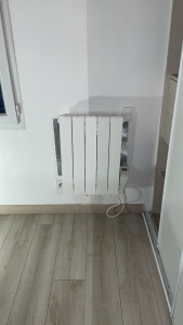 Photo de galerie - Pose de radiateur après rebouchage de trous
