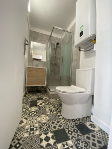 Photo de galerie - Pose sol plastique chauffe eau/ WC /cabine de douche 