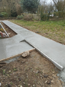 Photo de galerie - Réalisation d'une dalle béton pour entrée 