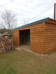 Photo de galerie - Agrandissement bâtiment ossature bois pose tôle et bardage bois