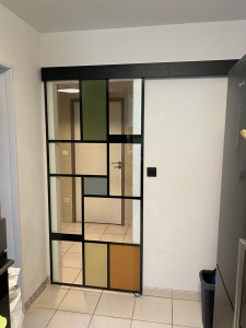 Photo de galerie - Pose porte vitrée sur système coulissant