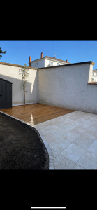 Photo de galerie - Création d’une terrasse en travertin et d’une terrasse en bois 