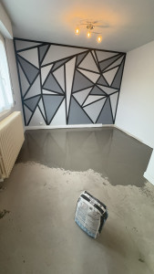 Photo de galerie - Réalisations d un mur en peinture et d un reagreage pour rattraper un sol de niveau 