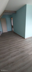 Photo de galerie - Pose du Parquet et plinthes dans la chambre 