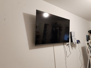 Photo de galerie - Installation tv sur support  mural + console de jeu