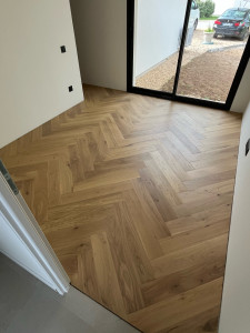 Photo de galerie - Réalisation d’un parquet chevron stratifié 