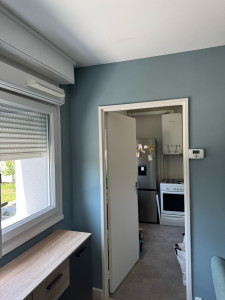 Photo de galerie - Peinture d’un salon couleur vert d’eau