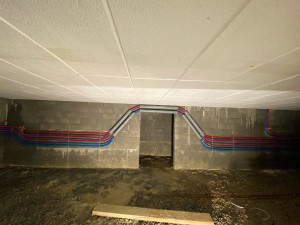 Photo de galerie - Passage de tuyaux multicouches chantier sanitaire 