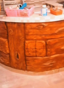 Photo de galerie - Création d’un comptoir de cuisine en béton effet bois 