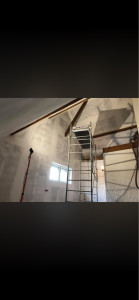 Photo de galerie - Réalisation des bandes a placo et ratissages avant peinture.