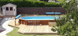 Photo de galerie - Piscine bois semi enterrée 670x410 + terrasse bois