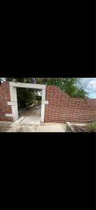 Photo de galerie - Mur en brique décoratif avec ouverture en pierre 