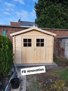 Photo de galerie - Création d'un dalle de béton plus carrelage plus installation d'un chalet de jardin 