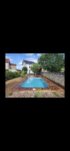 Photo de galerie - Réalisation de A à Z d'une piscine ( terrassement - piscine - plage et terrasse bois et massif mineral )