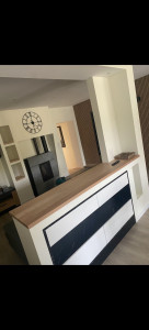 Photo de galerie - Réalisation d’un habillage bois sur muret intérieur