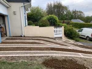 Photo de galerie - Création d’une montée de garage en pavés et béton désactivé.
Enduit monocouche 