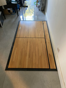 Photo de galerie - Pose d’une trappe en lamellé collé et métal pour accès à une cave à vin 