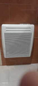 Photo de galerie -  installation 
de radiateur electric 