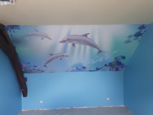 Photo de galerie - Pose d'un poster géant, peinture, et pose d'un parquet flottant.