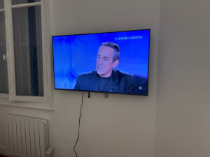 Photo de galerie - Fixation support TV Murale (Mur brique) 