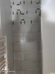 Photo de galerie - Pose des faïence dans une douche