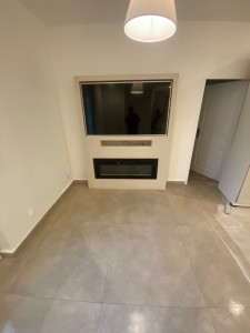 Photo de galerie - Réalisation de meubles, télé, plus cheminée, éclairante. 