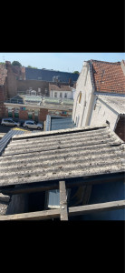Photo de galerie - Réalisation de travaux de dépose de matériaux contenant de l’amiante, avec conditionnement et évacuation vers une filière de traitement agréée