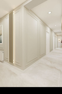 Photo de galerie - Réalisation d’un couloir haut de gamme : moulures, peinture propre et finitions élégantes.
