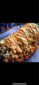 Photo de galerie - Banane plantain vert farcis beaucoup du viande avec légumes . sauce de la maison 