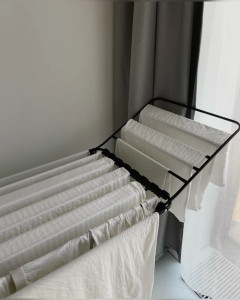 Photo de galerie - Séchage et organisation du linge réalisés avec soin pour préserver la qualité des textiles.